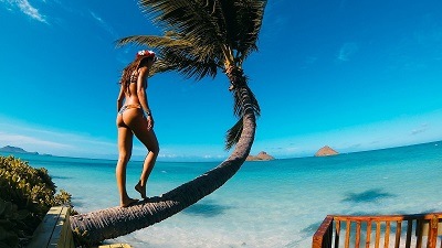 a girl in perfect shape wearing swimsuit in tropical Hawaiian island