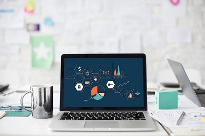 laptop displaying graphs and charts
