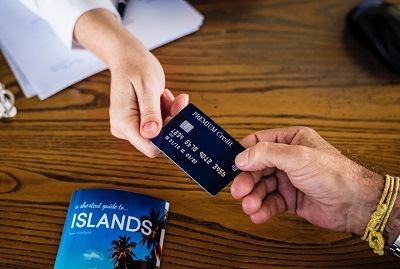 a consumer is booking a trip using her credit card